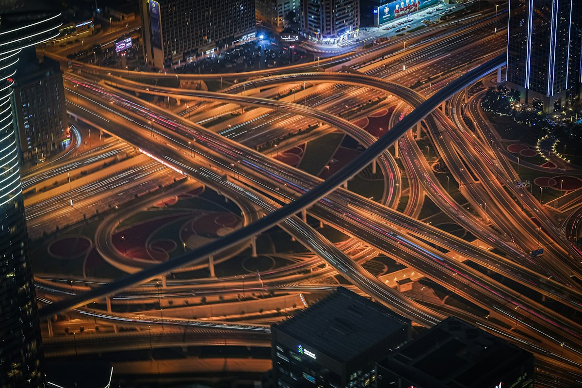Live aerial view of traffic flowing through a busy highway interchange